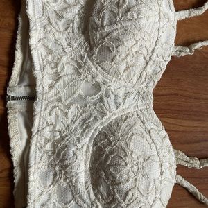 Very cute white corset top ! With a zipper up the back .